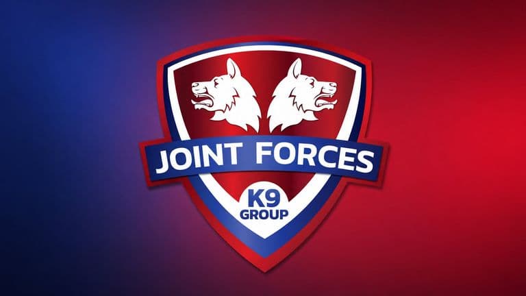 Joint Forces K9 Group logo featuring twin dog heads on a red and blue shield.