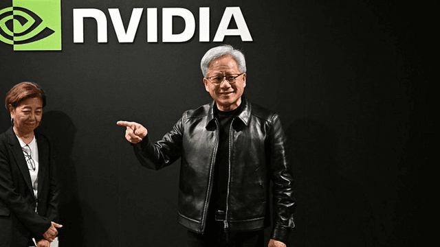 A man in a leather jacket gestures confidently beside a woman in a blazer, with NVIDIA logo.