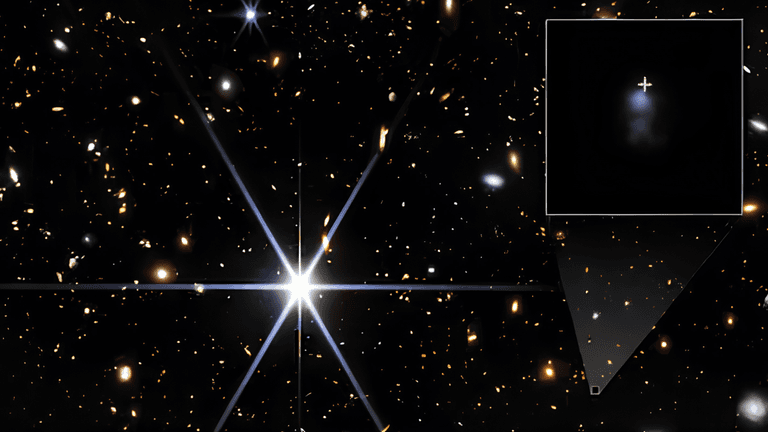 Astronomical image showing a bright star and distant galaxies in the background
