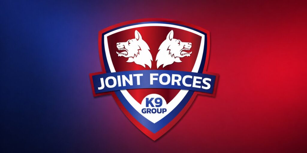 Joint Forces K9 Group logo featuring twin dog heads on a red and blue shield.